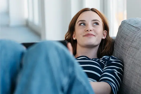 Smiling woman on her couch